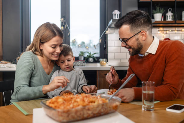 istock A cheerful family is having a dinner at home 1835737517