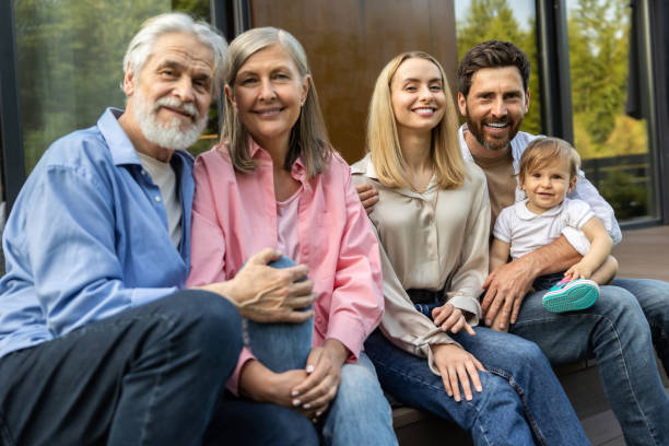 istock Cute young couple with their baby looking happy 1835738081