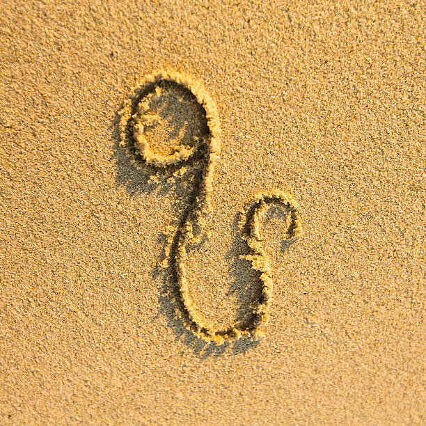 istock Zodiac sign Leo, drawn on the facture beach sand 183574114