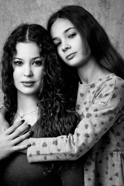 istock Portrait of two beautiful serious sisters 1835747801