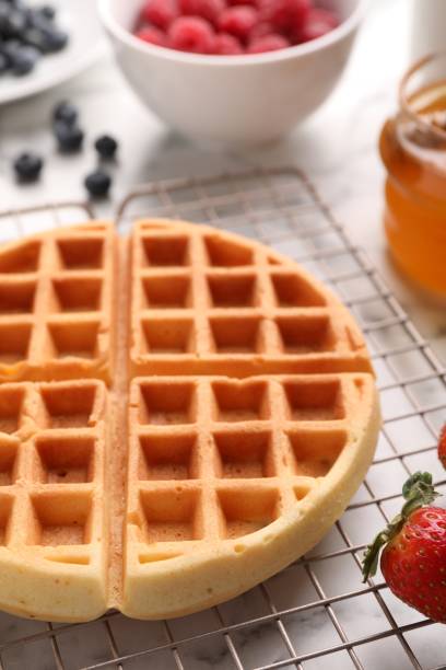 istock Tasty Belgian waffle with strawberry on table, closeup 1835768227