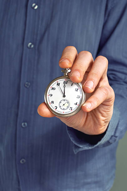 istock Old pocket watches in hand 183577639