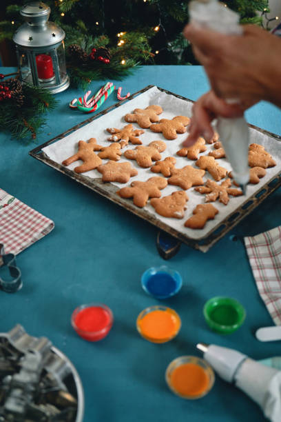 istock Decorating Gingerbread Christmas Cookies with Icing 1835789141