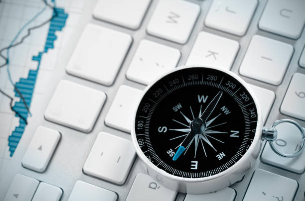 istock Compass and stock market chart 183579036