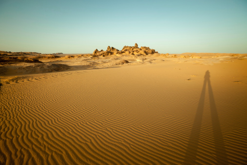 Prolonged shadow in Libyan Sahara desert