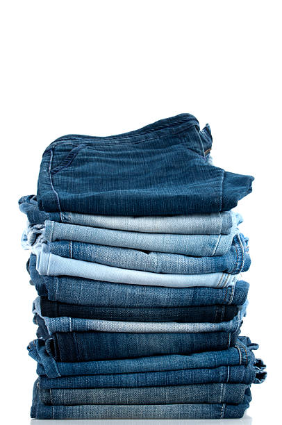 Pile of Jeans Pile of Jeans Isolated on White Background denim stock pictures, royalty-free photos & images