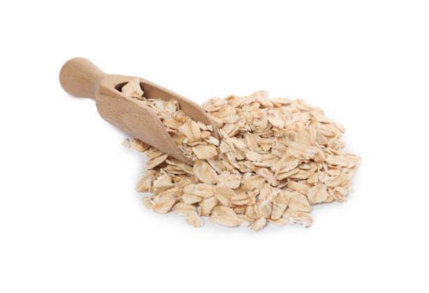 istock Wooden scoop with oatmeal isolated on white 1835796826
