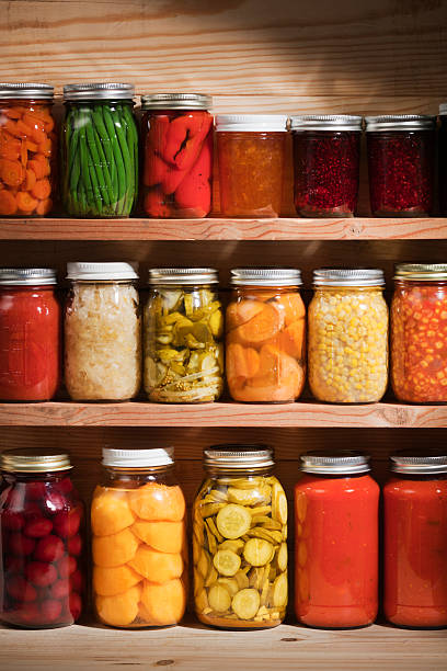 istock Food Preserves Canning Jars on Shelves, Fruit and Vegetable Storage 183580739