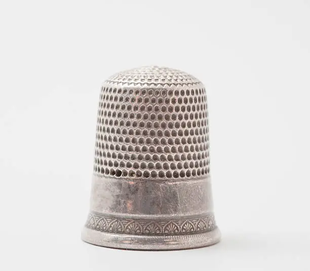 An old thimble shot on a white background.More images you may like: