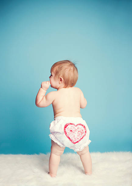 Little Toddler Girl With Valentine Hearts on Bloomers stock photo