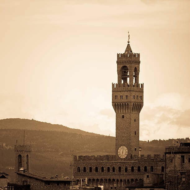 Vintage feelings shot of the old Palazzo della Signoria (also known as Palazzo Vecchio) in Florence with the tuscan hills on the background.