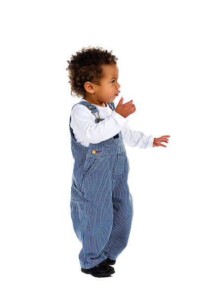 istock Side View Of Toddler Standing And Moving His Hands 183581362