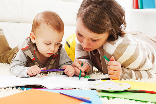 istock Family are lying on the floor and drawling. 183581393