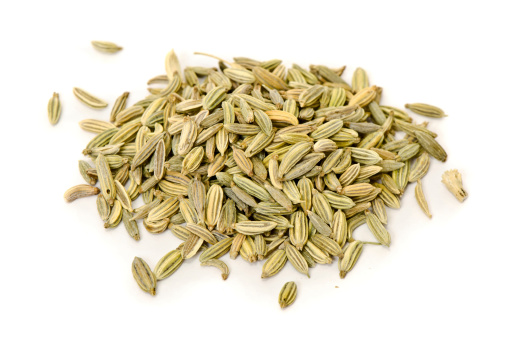 Macro of Fennel seeds. Isolated on white.