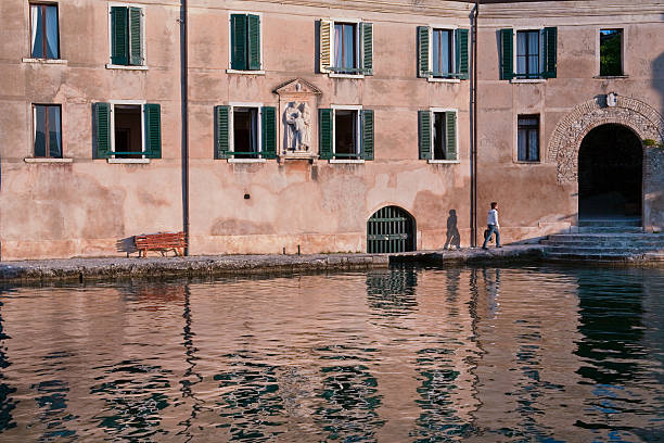 Punta San Vigilio is a small promontory stretching into the lake, surrounded by cypresses and olive trees. It is one of the jewels of Lake Garda, known worldwide for its romantic atmosphere. Lake Garda, Italy. Canon EOS 5D.