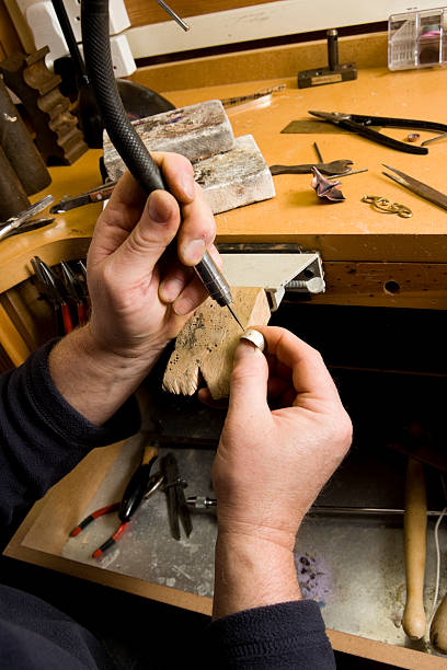 istock Jeweller drilling metal 183582277