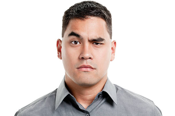 Uncertain Young Man Raises One Eyebrow Portrait of a young man on a white background.http://s3.amazonaws.com/drbimages/m/jamle.jpg confused face stock pictures, royalty-free photos & images