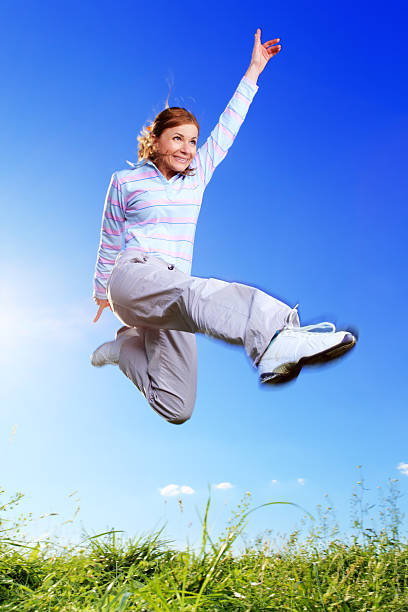 istock Cheerful girl against the blue sky. 183582870