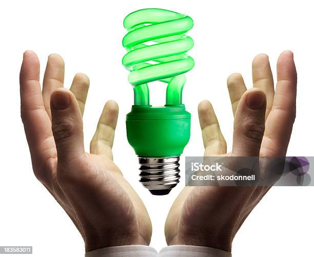 Alternative Energy Lightbulb Floating Above The Hands Stock Photo - Download Image Now