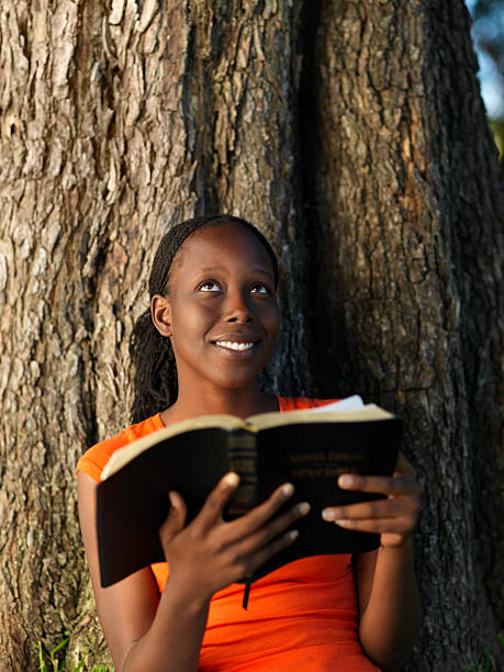 istock Christian woman holding a Bible 183583021