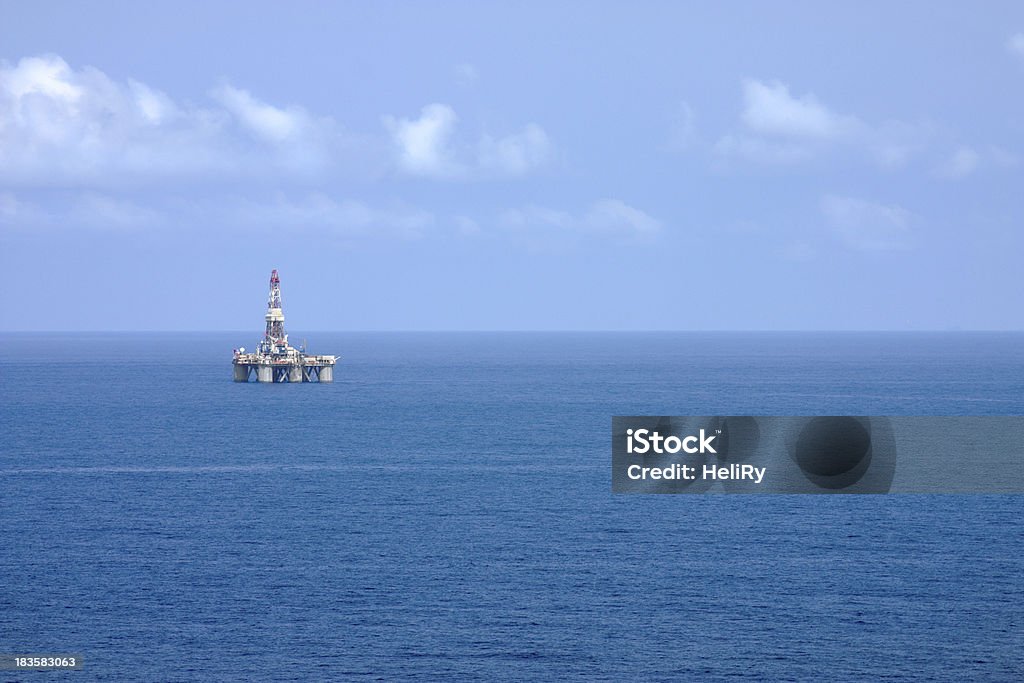 Offshore Oil Rig Distant aerial photo of a semi-sub oil rig at sea. Offshore Platform Stock Photo