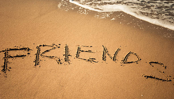 istock Friends message in the sand 183583114