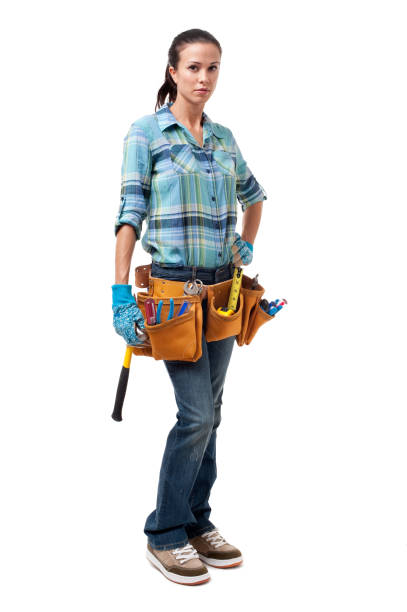 Woman Construction Contractor Carpenter Isolated on White Background Woman Construction Contractor Carpenter Isolated on White Background woman wearing tool belt stock pictures, royalty-free photos & images