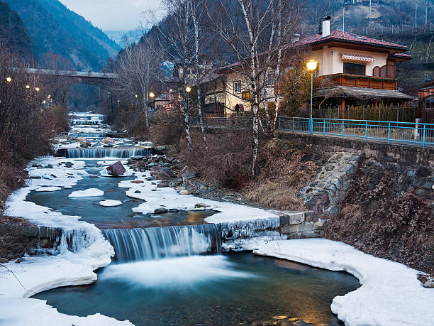 The Isarco river passing through the mountain village of Chiusa (Klausen) in the Alto Adige region of Italy. Long exposure