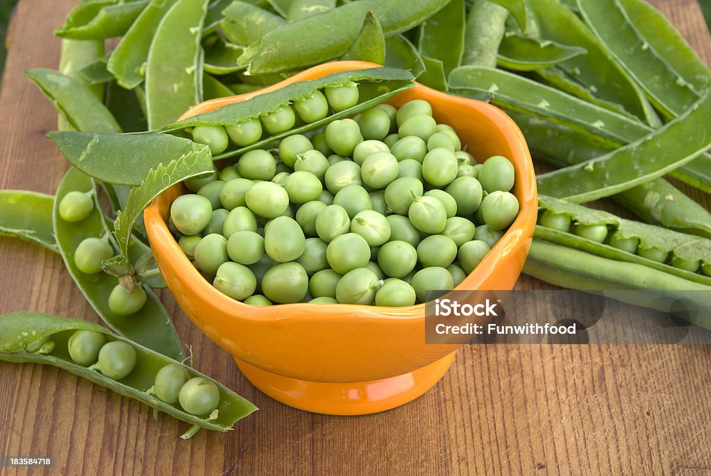Fresh Green Peas, Cooking & Preparing Healthy Food, Spring Vegetable Background "Fresh English green spring peas & in pods. (SEE LIGHTOBOXES BELOW for more food preparation, organic vegetables & cooking backgrounds...)" Bowl Stock Photo