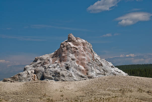 White Dome Geyser White Dome Geyser is a 12 foot high cone type geyser located near Firehole Lake in the Lower Geyser Basin of Yellowstone National Park, Wyoming, USA. jeff goulden yellowstone national park stock pictures, royalty-free photos & images