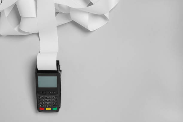istock Payment terminal with thermal paper for receipt on light grey background, top view. Space for text 1835867645