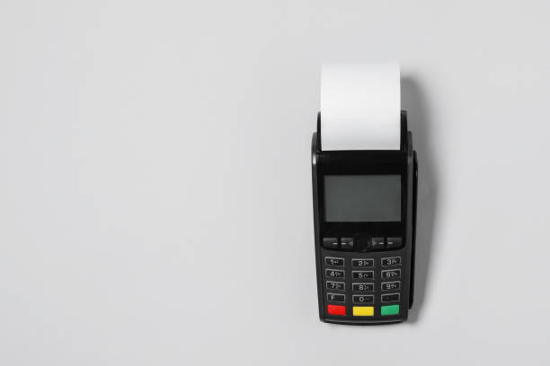 istock Payment terminal with thermal paper for receipt on light grey background, top view. Space for text 1835867762