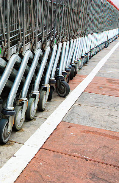 istock Many stainless trolleys in row 183587406
