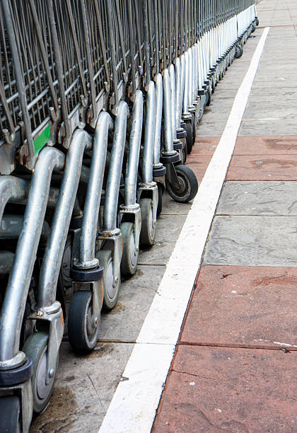 istock Many stainless trolleys in row 183587409