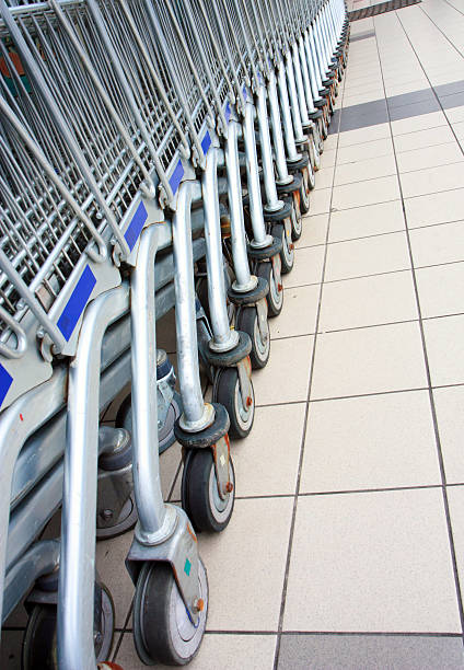 istock Many stainless trolleys in row 183587411