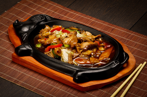 Hot Chinese food on the wooden table