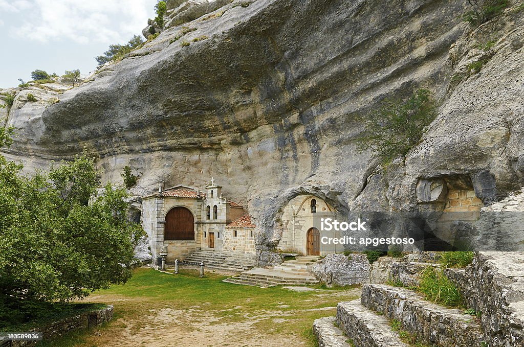 San Bernabe Chapel in Ojo Guareña, Burgos, Spain San Bernabe chapel is built inside natural caves eroded by Guareña river. Burgos Stock Photo