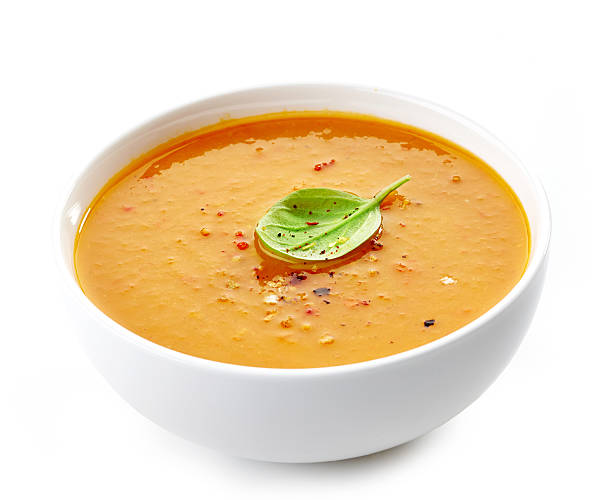 Bowl of squash soup Bowl of squash soup on a white background soup stock pictures, royalty-free photos & images