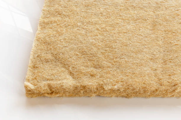 materials background - compressed thermal insulating hemp fiber bonded panels.
