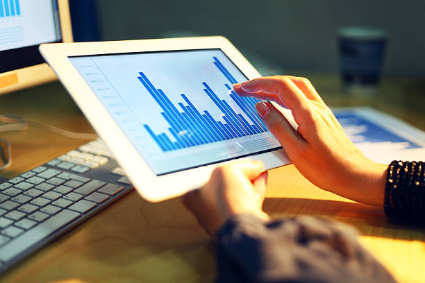 istock Image of human hand pointing at touchscreen with business graph 183593123