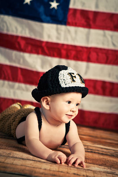 istock Adorable Baby Firefighter 183593581