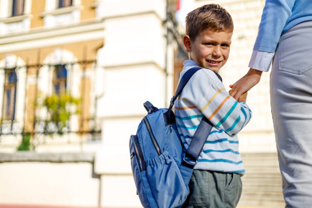 istock Encouragement on son's first school day 1835939443