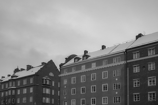 Low angle view of buildings against sky at winter