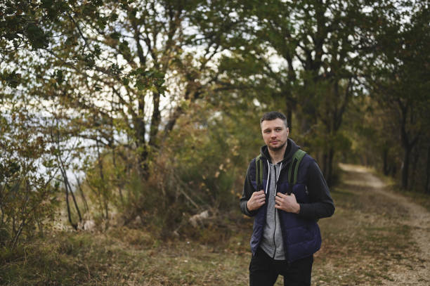 istock hiking backpacker in a woodland. 1835986565
