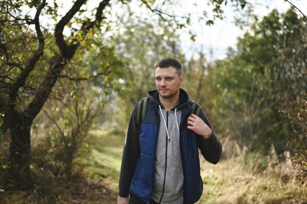 istock Young backpacker in woodland. 1835988639