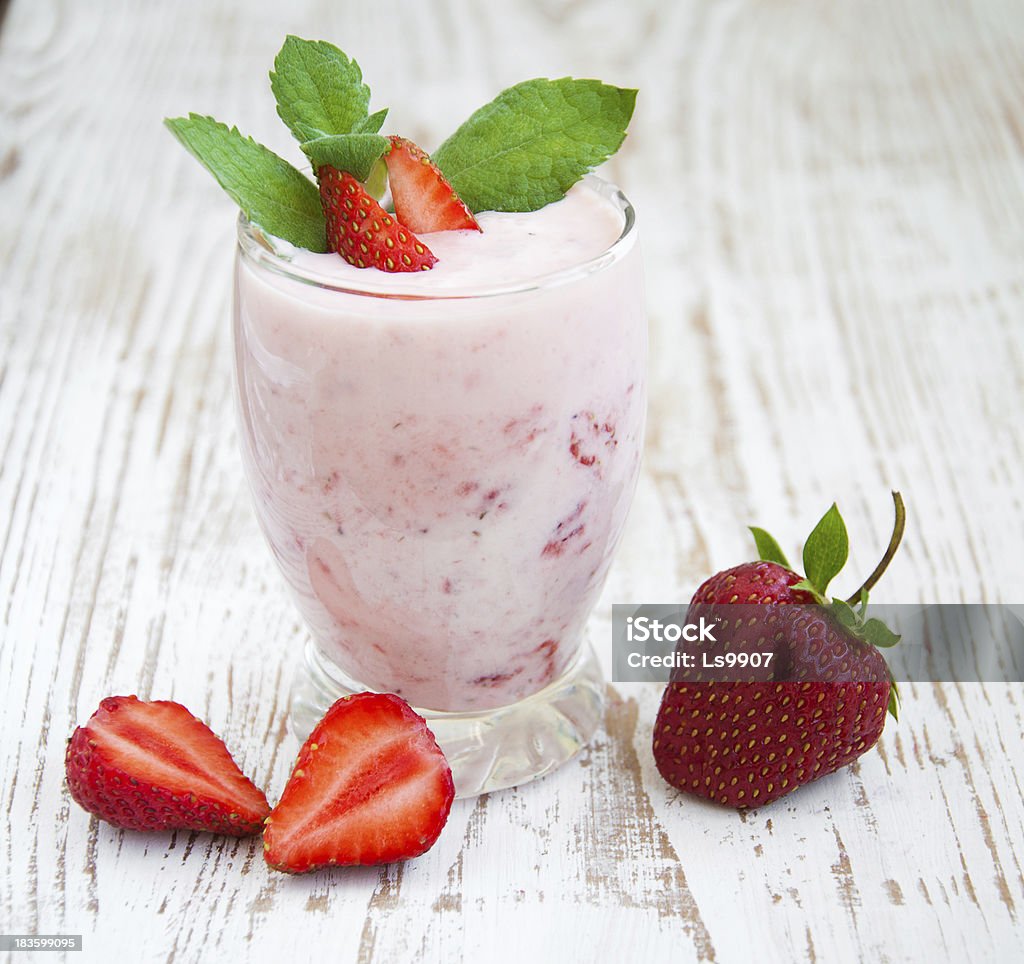 Strawberry Yogurt Glass of strawberry yogurt, with fresh strawberries Berry Fruit Stock Photo