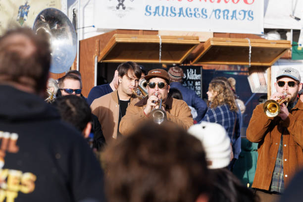 Band Guerrilla Fanfare playing while moving through the Christkindl Market in Denver, Colorado USA December 2023