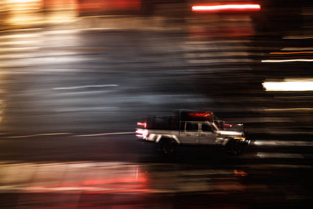 istock Silver truck navigates its way through city streets 1836010360