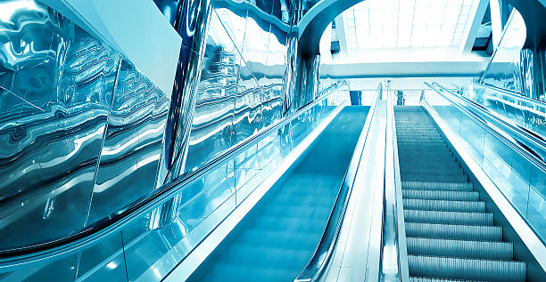 istock blue modern escalator in business center 183601758