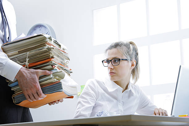 istock overworked businesswoman 183602556